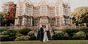 The married couple in front of the Hall