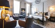 A bedroom inside of the Poster Suites at The Queensberry Hotel in Bath