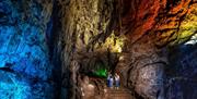 Family in illuminated Wookey Hole Caves - Caves near Bristol and Bath