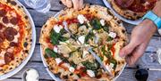 A spinach, artichoke and ricotta pizza
