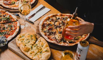Pizzas and garlic bread