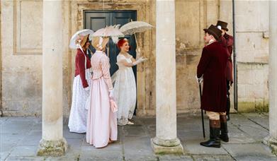 A group of people wearing Regency costume