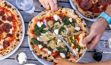 A spinach, artichoke and ricotta pizza
