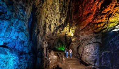 Family in illuminated Wookey Hole Caves