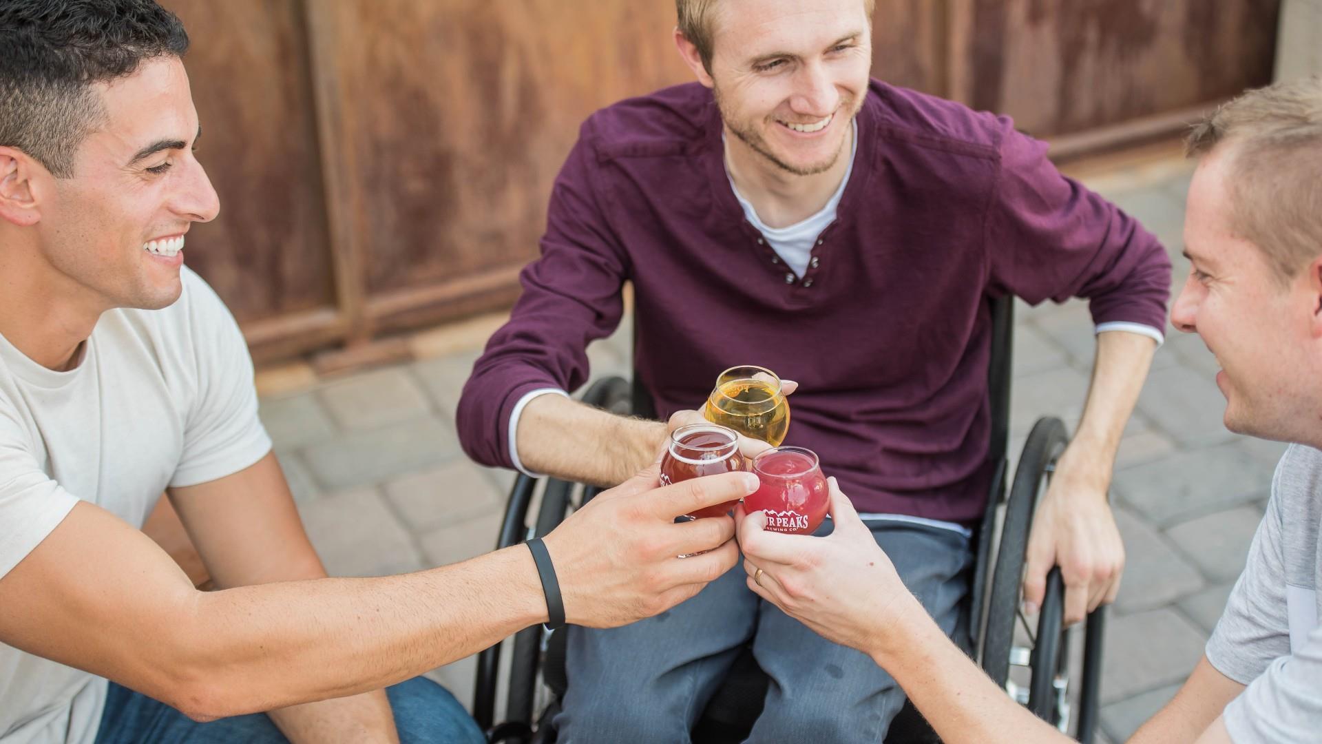 Men Drinking beer, wheelchair user, friends