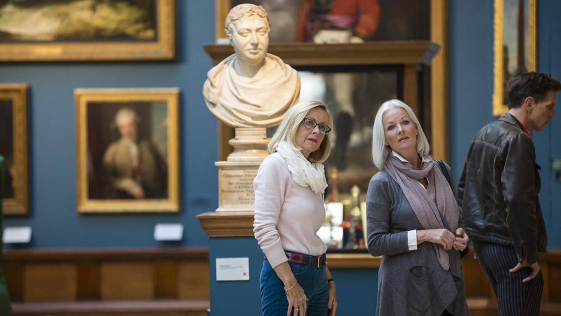 Visitors browse the exhibits at Victoria Art Gallery