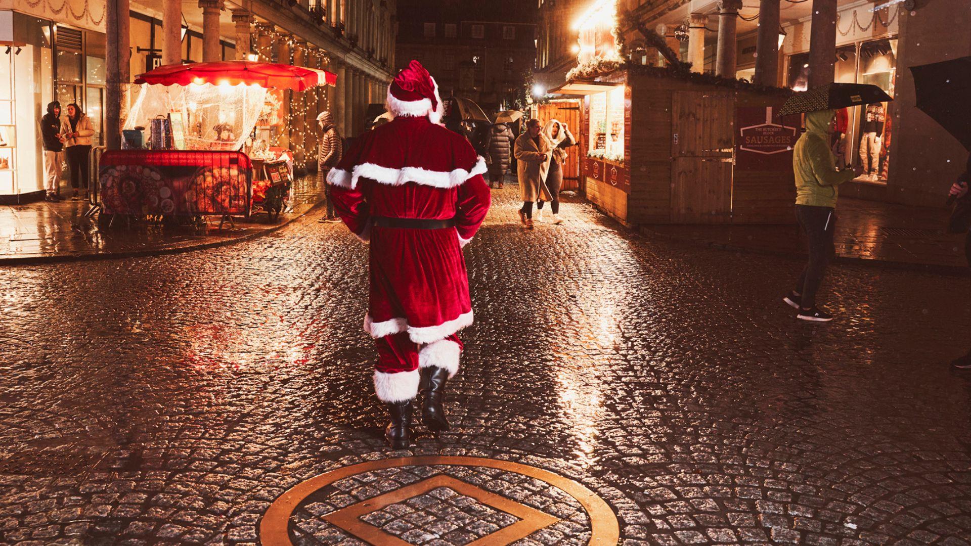 Father Christmas with World Heritage sign Stall Street