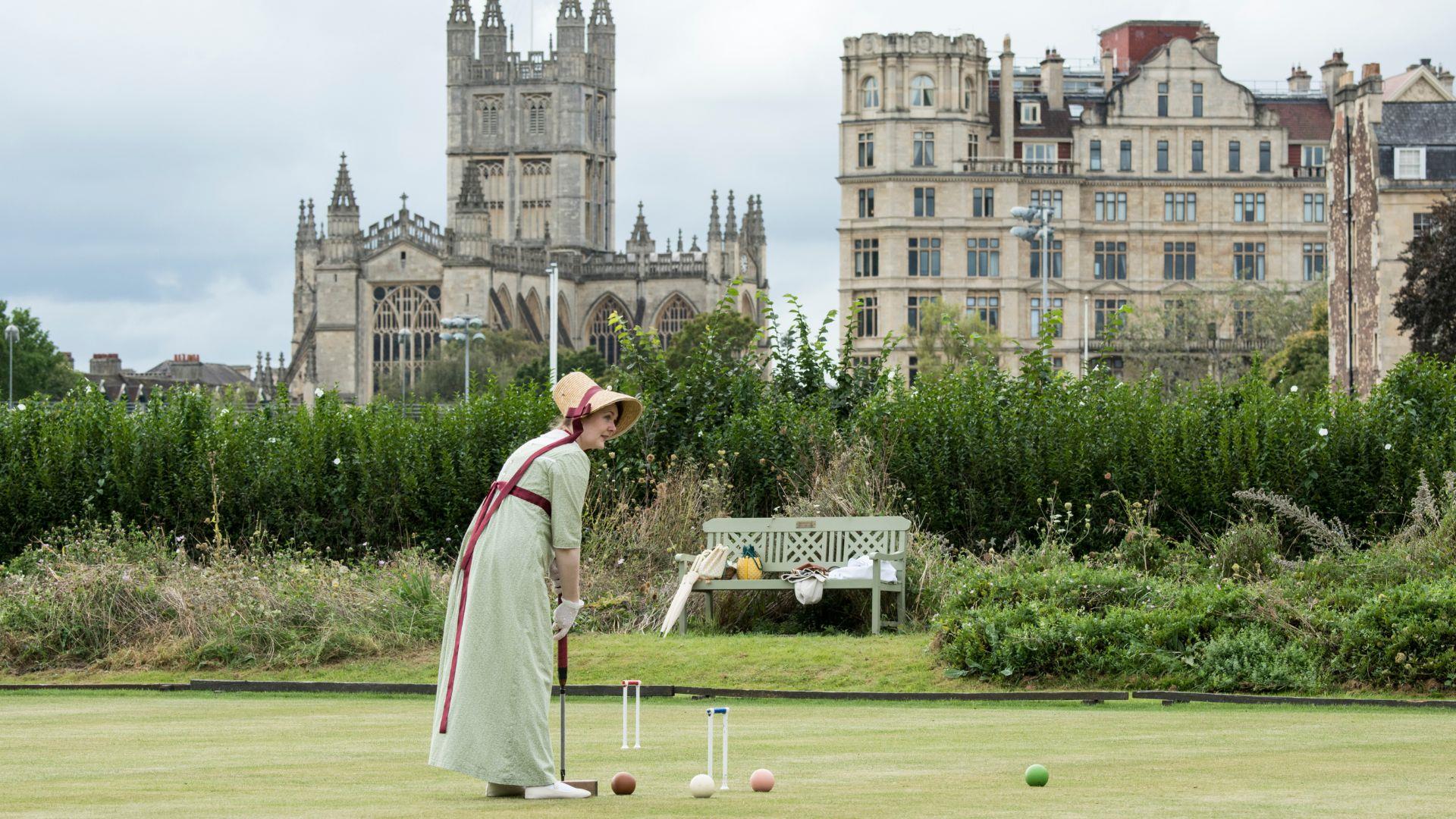 Woman playing croquet at Jane Austen Festival