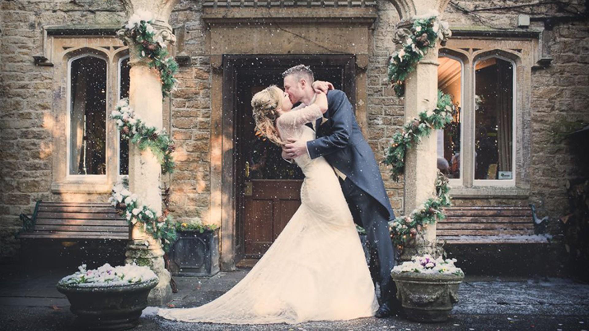 Couple kiss in the snow