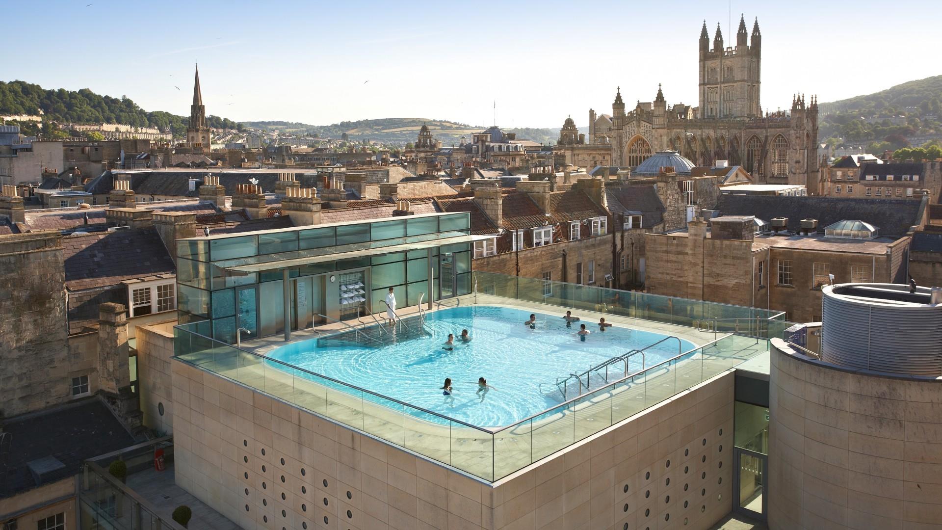 Thermae Bath Spa rooftop pool and Bath's city skyline by day