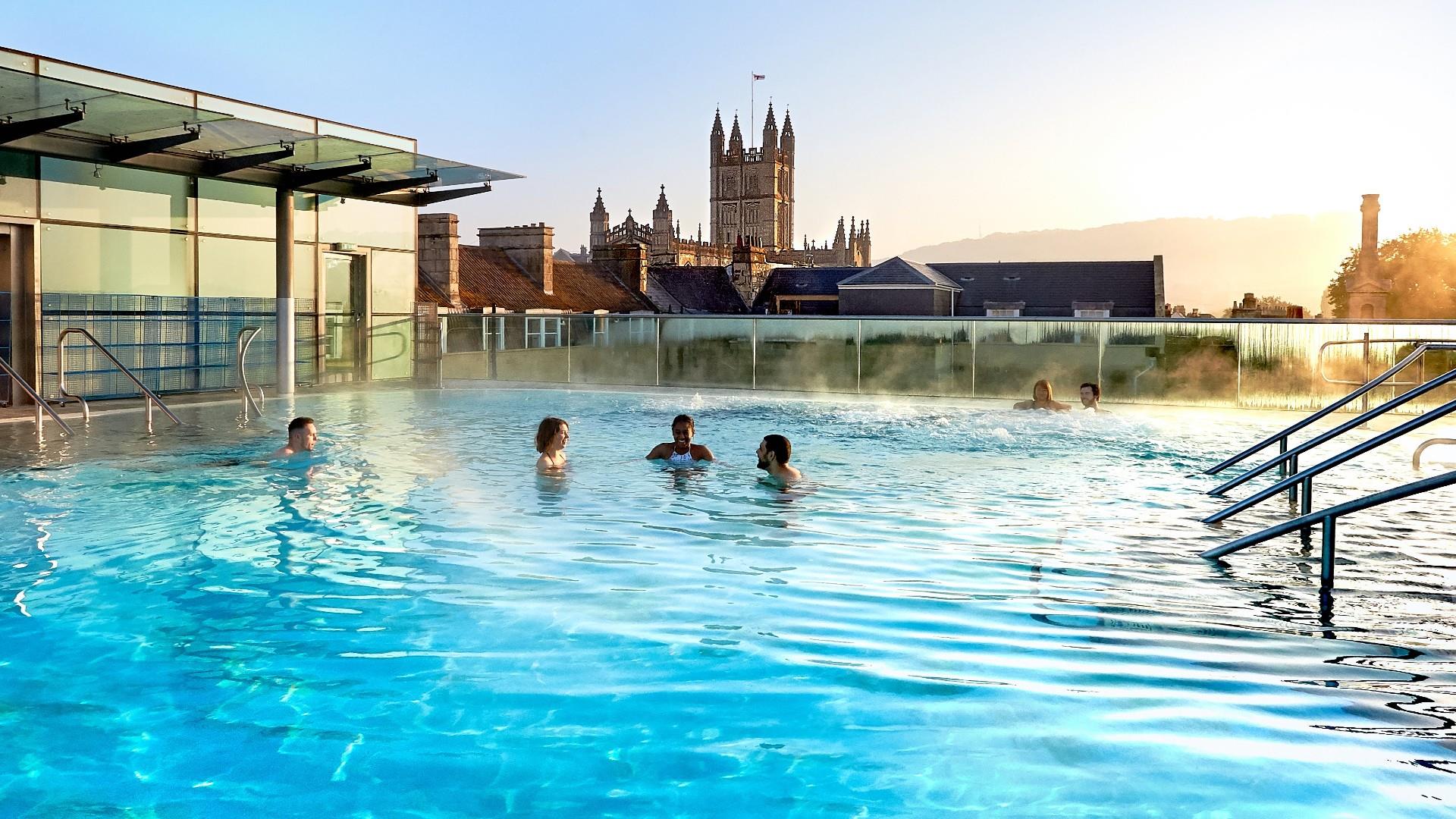 Thermae Bath Spa rooftop pool with bright sky and people