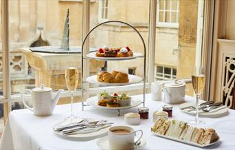 An afternoon tea at the Pump Room Restaurant, featuring scones, cakes, and sandwiches