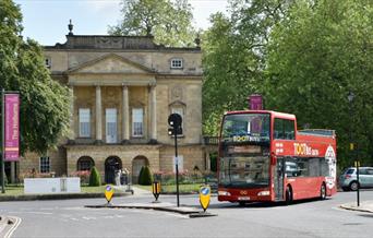 A Tootbus Bath open-top bus outside The Holburne Museum, Bath