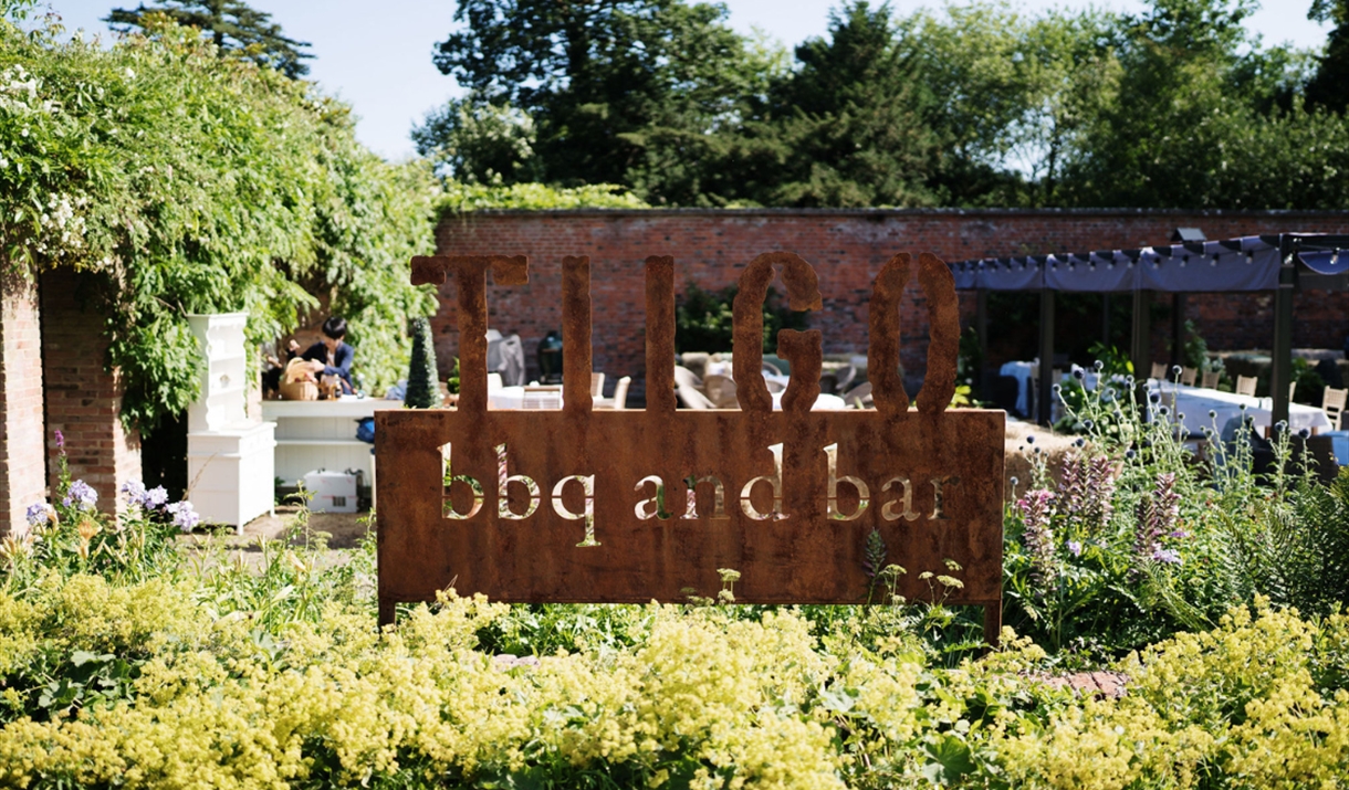 TIIGO BBQ sign in garden