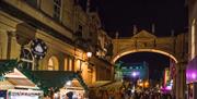 Bath Christmas Market stalls along York Street in Bath
