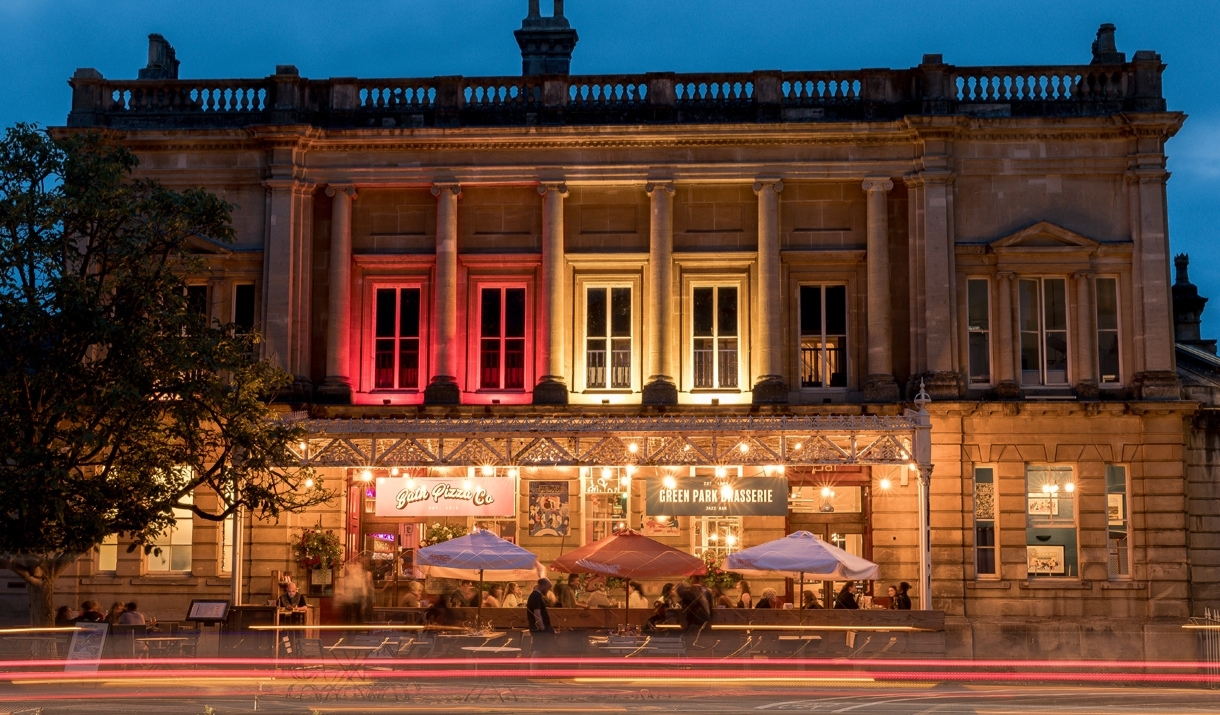 Exterior view of Green Park Brasserie and Bath Pizza Co by night. Exterior view of Green Park Brasserie and Bath Pizza Co by night.