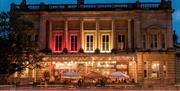 Exterior view of Green Park Brasserie and Bath Pizza Co by night.