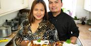 Couple holding plate of food