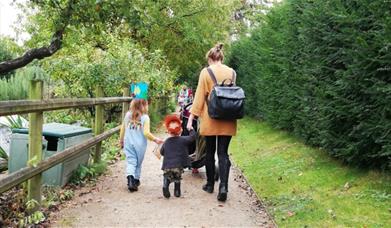 A family following a trail at Bishop's Palace, Wells