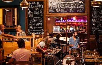 A band of musicians performing in the restaurant at Green Park Brasserie, Bath