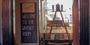 Entrance to Independent Spirit Whiskey Room- welcome sign
