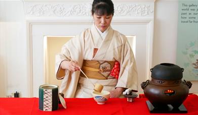 A woman performing a Japanese Tea Ceremony