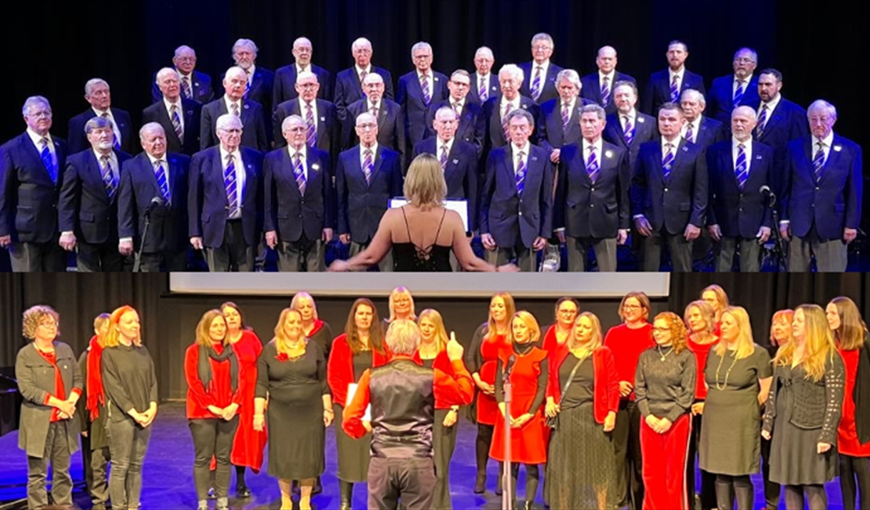 Two choirs with conductors - the Glastonbury Male Voice Choir, and Viva Vocals.
