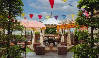 Summer terrace at The Bird with bunting