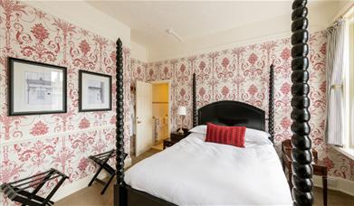 A four poster bedroom at The Royal Hotel Bath