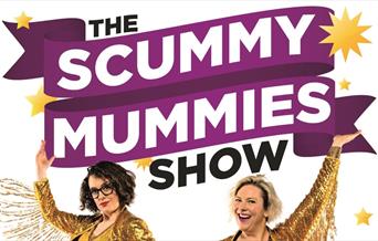 Two women holding up a banner for The Scummy Mummies Show