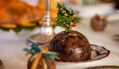 A Christmas pudding sitting on a table 