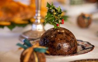 A Christmas pudding sitting on a table