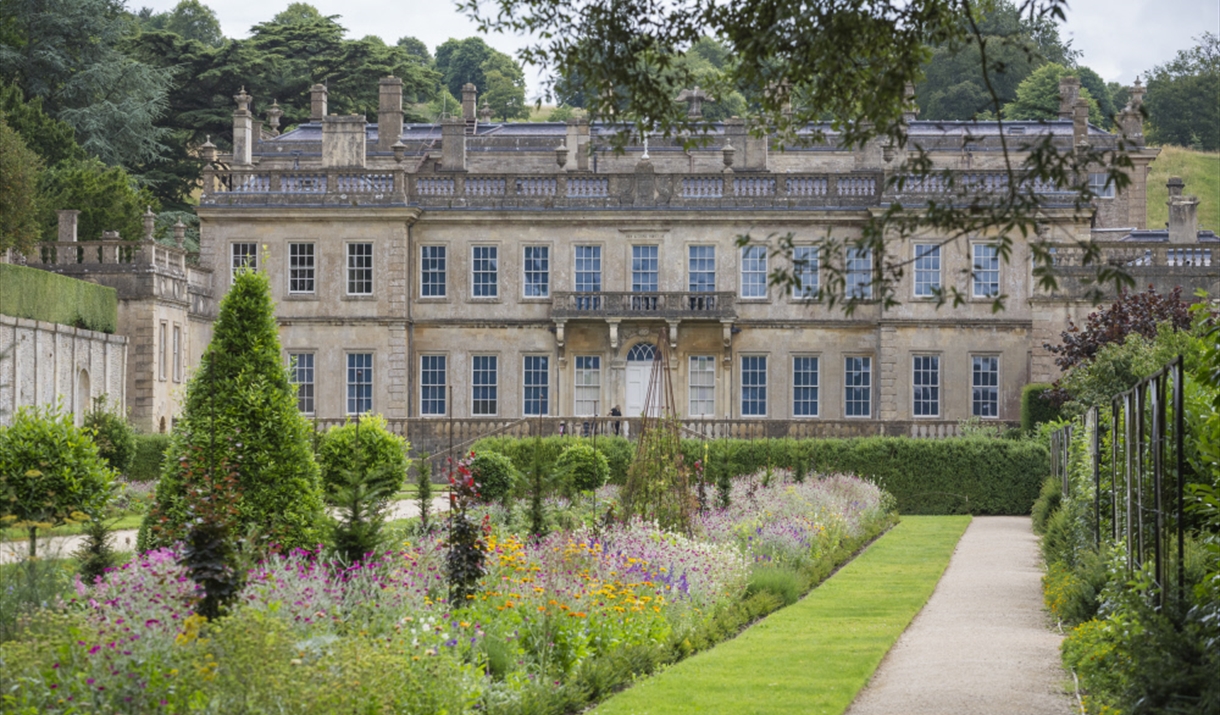 View of the West Front and garden in summer at Dyrham Park.