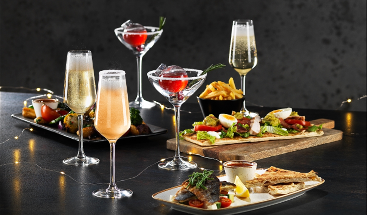 Image shows a selection of Bar + Block's festive lunch food and drinks.